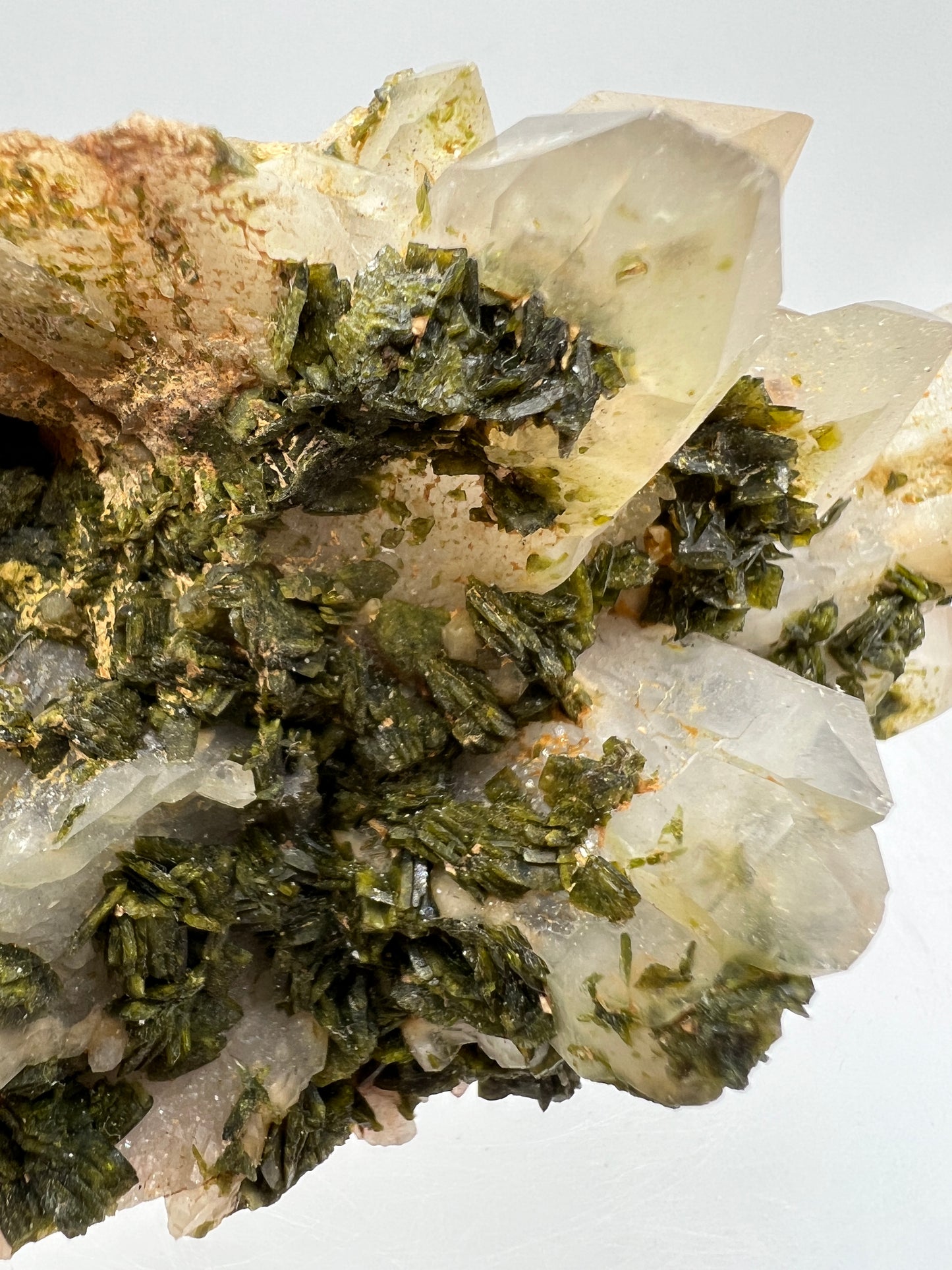 Epidote And Quartz Specimen. Stunning Quartz Cluster With Peach Inclusions Covered In Epidote.