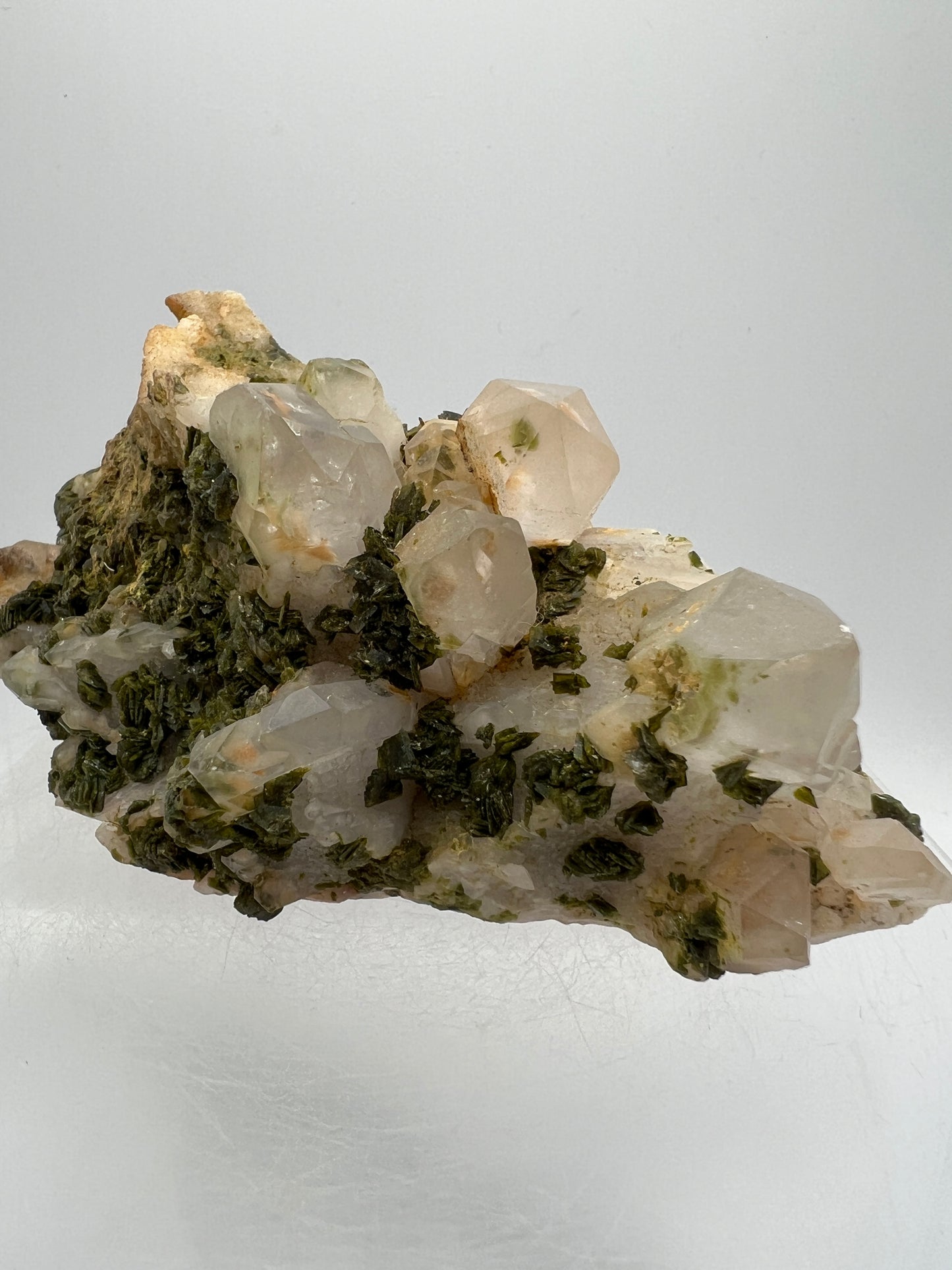 Epidote And Quartz Specimen. Stunning Quartz Cluster With Peach Inclusions Covered In Epidote.