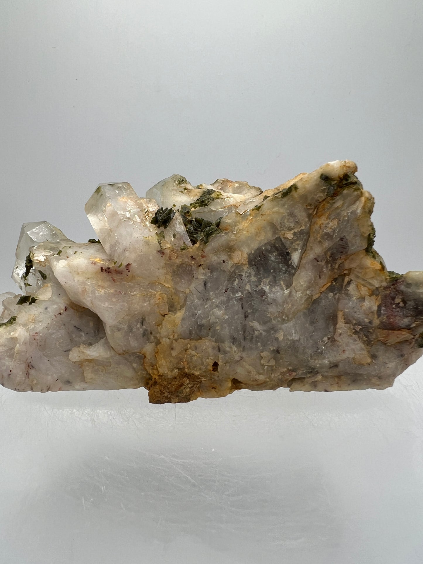 Epidote And Quartz Specimen. Stunning Quartz Cluster With Peach Inclusions Covered In Epidote.