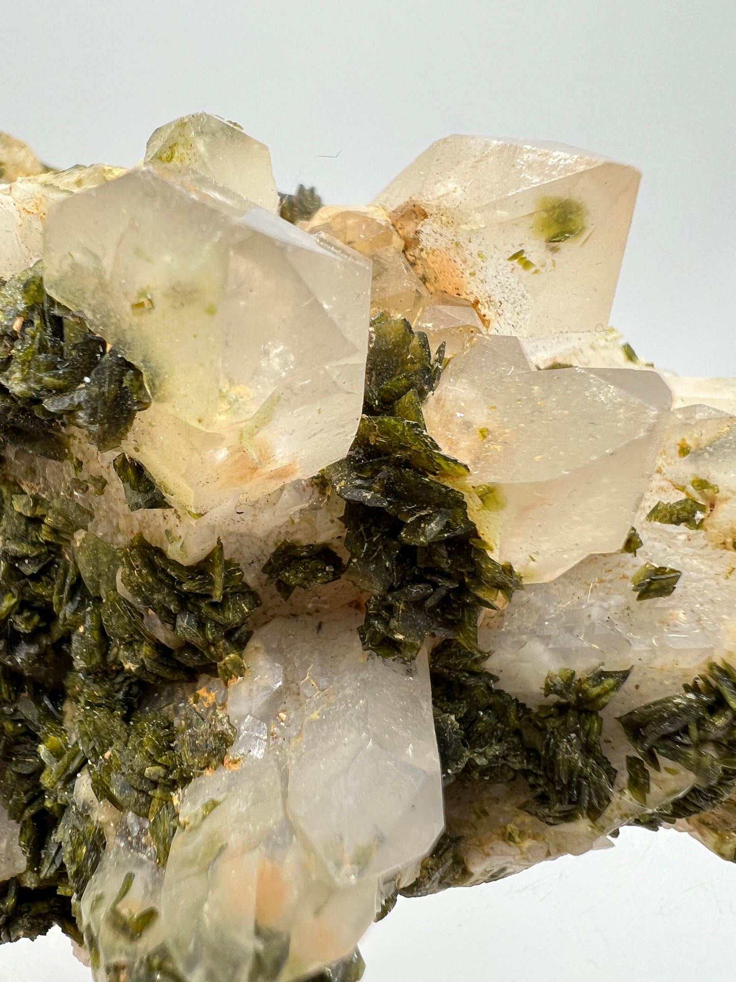 Epidote And Quartz Specimen. Stunning Quartz Cluster With Peach Inclusions Covered In Epidote.